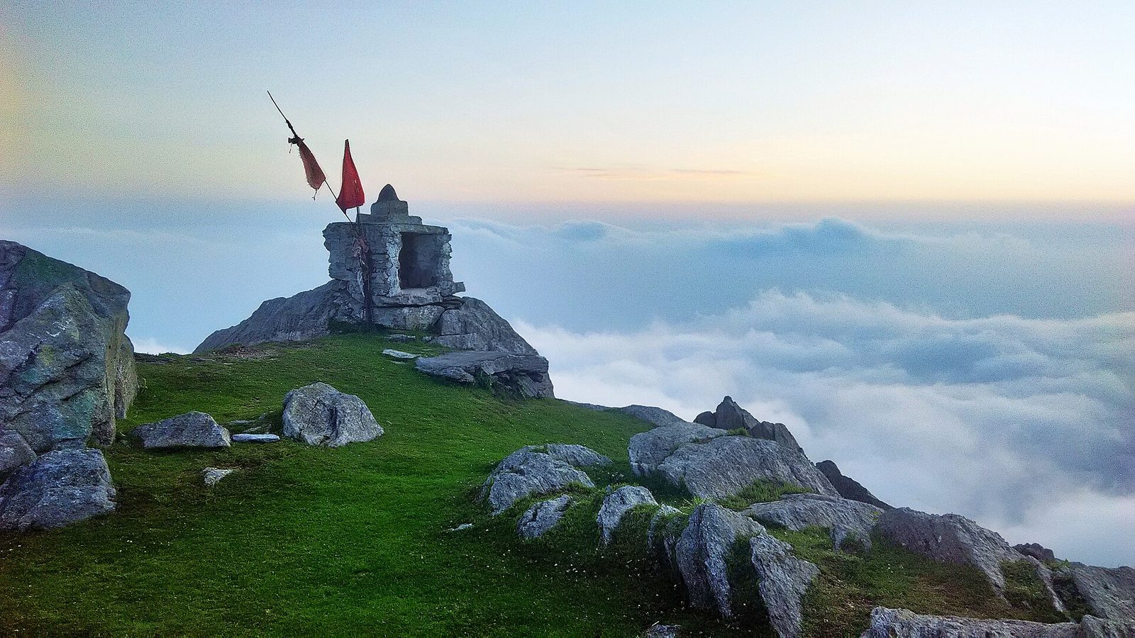 Trekkers on the Triund trail above the clouds in the Dhauladhar range