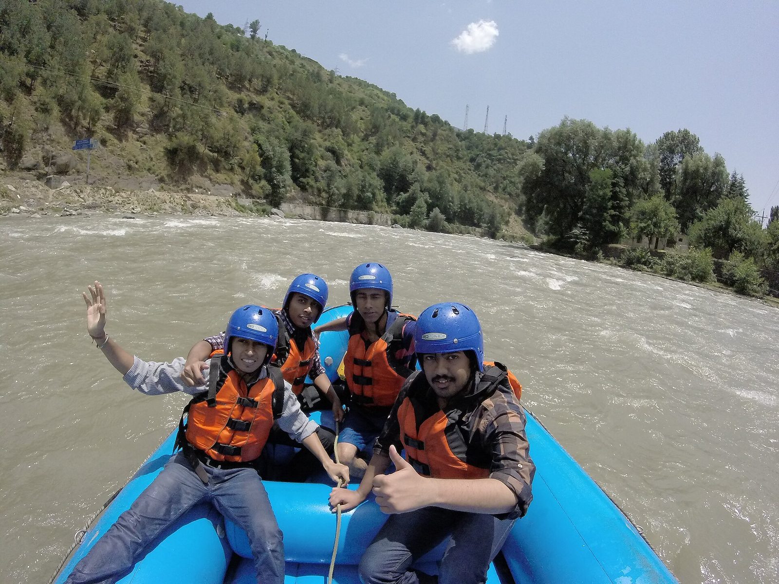 Travellers river rafting on the Beas River in Kullu, Himachal Pradesh
